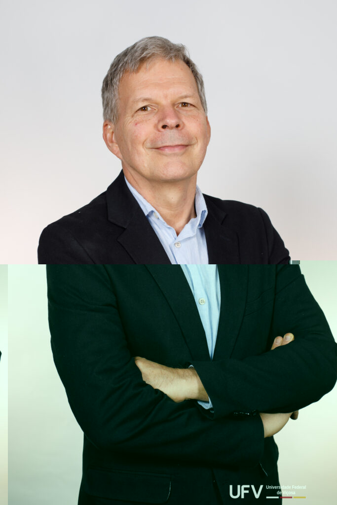 Foto de meio corpo. Luiz Antônio é um homem de meia-idade, pele clara, estatura mediana, magro, cabelos grisalhos lisos curtos e partidos de lado, sobrancelhas finas curtas e grisalhas, olhos pequenos e castanhos, nariz largo, lábios finos. Ele usa terno preto e camisa azul clara, sem gravata. Ele está com os braços cruzados e dá um leve sorriso. 